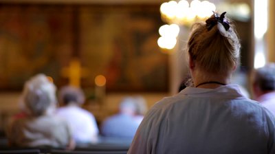 stock-footage-view-from-behind-of-people-sitting-in-church-in-copenhagen-denmark